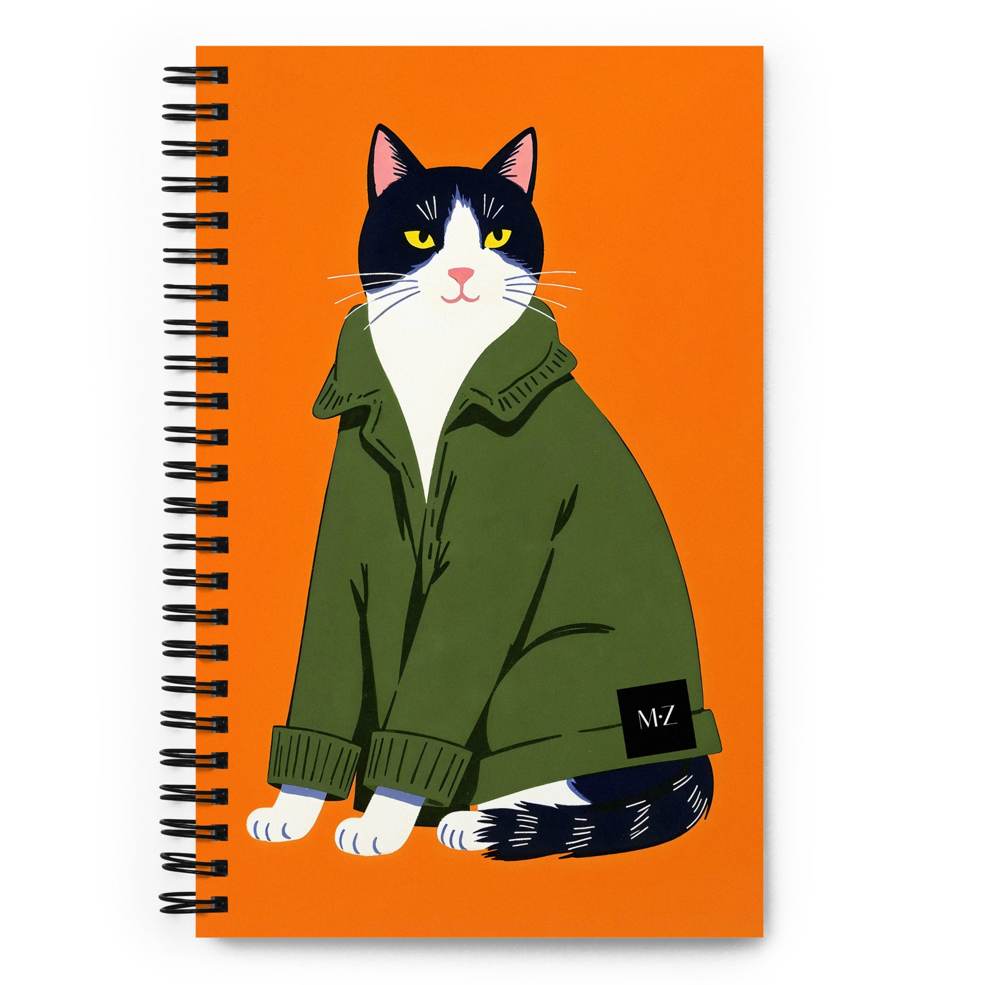 Carnet A5 Crunchy Truffle Mzelle design, style naïf et graphique, chats bicolore mignon habillé de pull sur fond orange vif