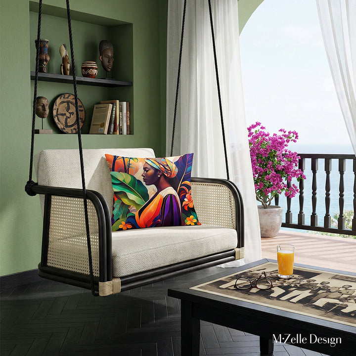 Photographie lifestyle de décoration tropicale présentant un superbe fauteuil  au design contemporain en rotin verni foncé orné d'un large coussin coloré mzelle design, l'assise et le dossier sont en tissu texturé blanc cassé, cannage écru sur les côtés, exposé dans un lodge tropical lumineux. table basse en bois noir , cavité dans le mur avec des objets afro-cubain.