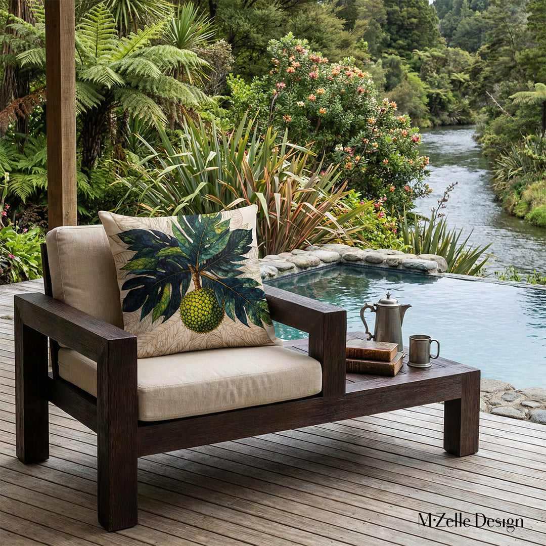 Photographie professionnelle extrêmement détaillée d'une terrasse d'écolodge esprit nature, vue de face en gros plan sur 1 fauteuil orné d'un grand coussin motif feuilles et fruit à pain mzelle design,  jardin botanique, livres et cafetière ancienne et tasse en étain sur la table basse, une piscine extérieure à débordement en bord de rivière, ambiance cosy et invitante.