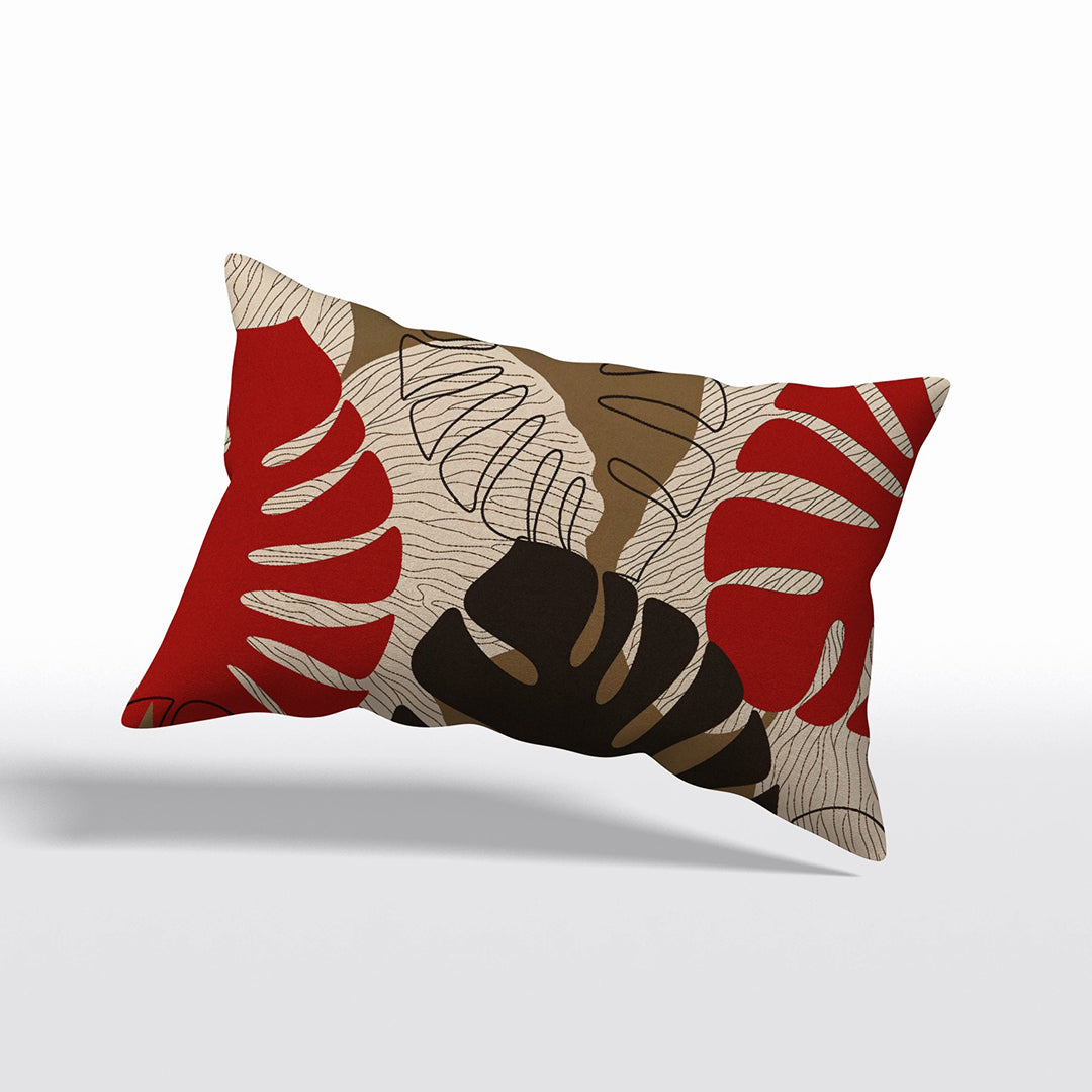 Coussin décoratif rectangulaire Mzelle Design aspect Lin imprimé avec des Monsteras Deliciosa enlacées sur fond de composition graphique, écru, rouge et marron cacao.