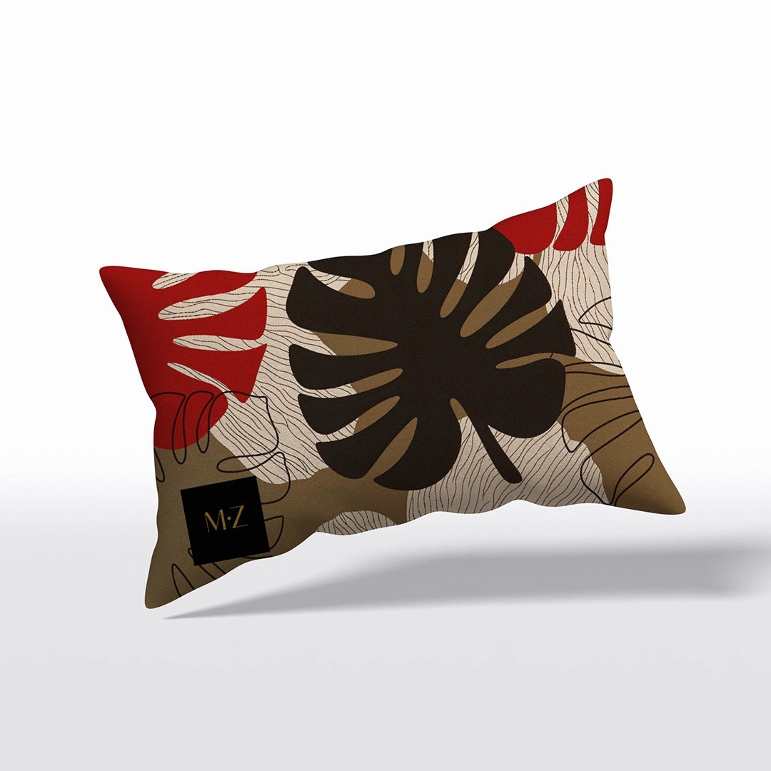 Coussin décoratif rectangulaire Mzelle Design aspect Lin imprimé avec des Monsteras Deliciosa enlacées sur fond de composition graphique, écru, rouge et marron cacao.