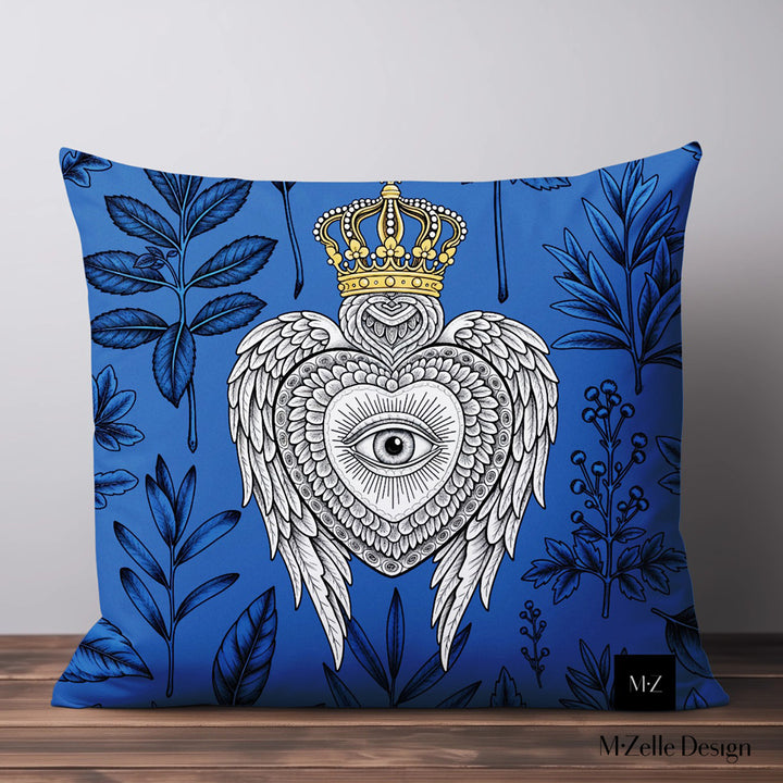 Housse de Coussin EX VOTO Mzelle design -  motif liturgique coeur avec un oeil et des ailes sur fond d'herbier bleu et nir