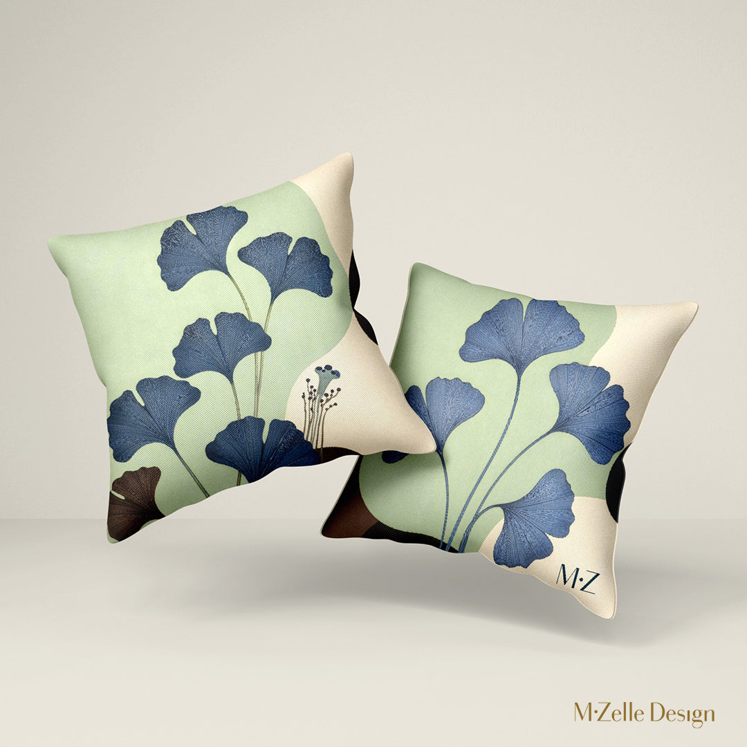 Deux Coussins de décoration moderne MZelle Design imprimé d'un motif stylisé feuilles de Ginkgo couleurs pastel belu, vert pale et écru