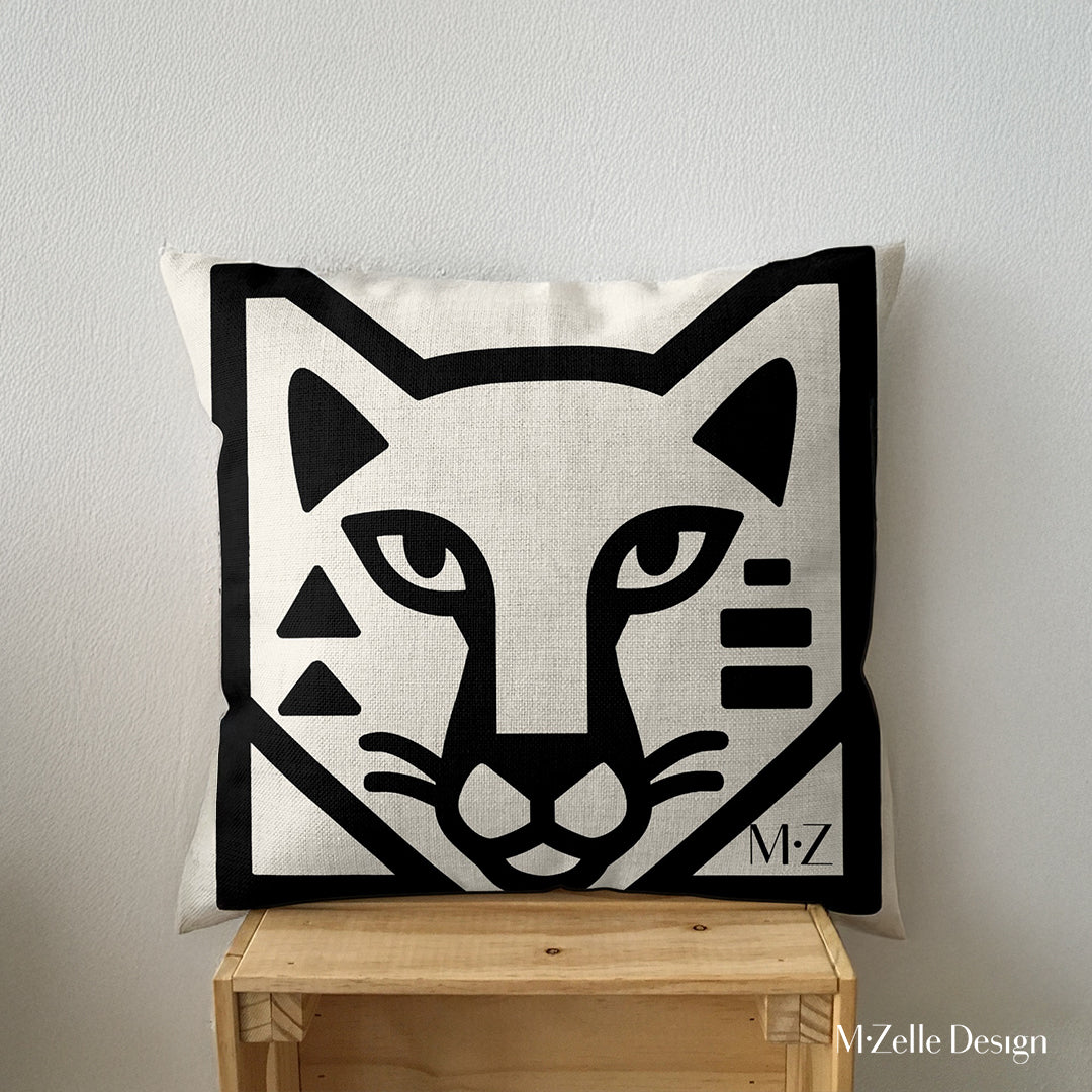 coussin graphique Mzelle Design - tête de puma bicolore noir et écru, brut et élégant, entre art tribal et design contemporain