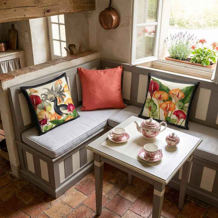 Photo professionnelle de décoration, maison d'hôte provençale, cuisine avec un angle aménagé avec une banquette-coffre moderne en bois peint rayures gris moyen et blanc, disposition harmonieuse de 3 coussins décoratifs mzelle design motif oiseau et arums, et un coussin uni corail au milieu , sol tomette rustique, table assortie, garnie d'un service à thé en porcelaine fine motifs provençaux. Atmosphère printanière.