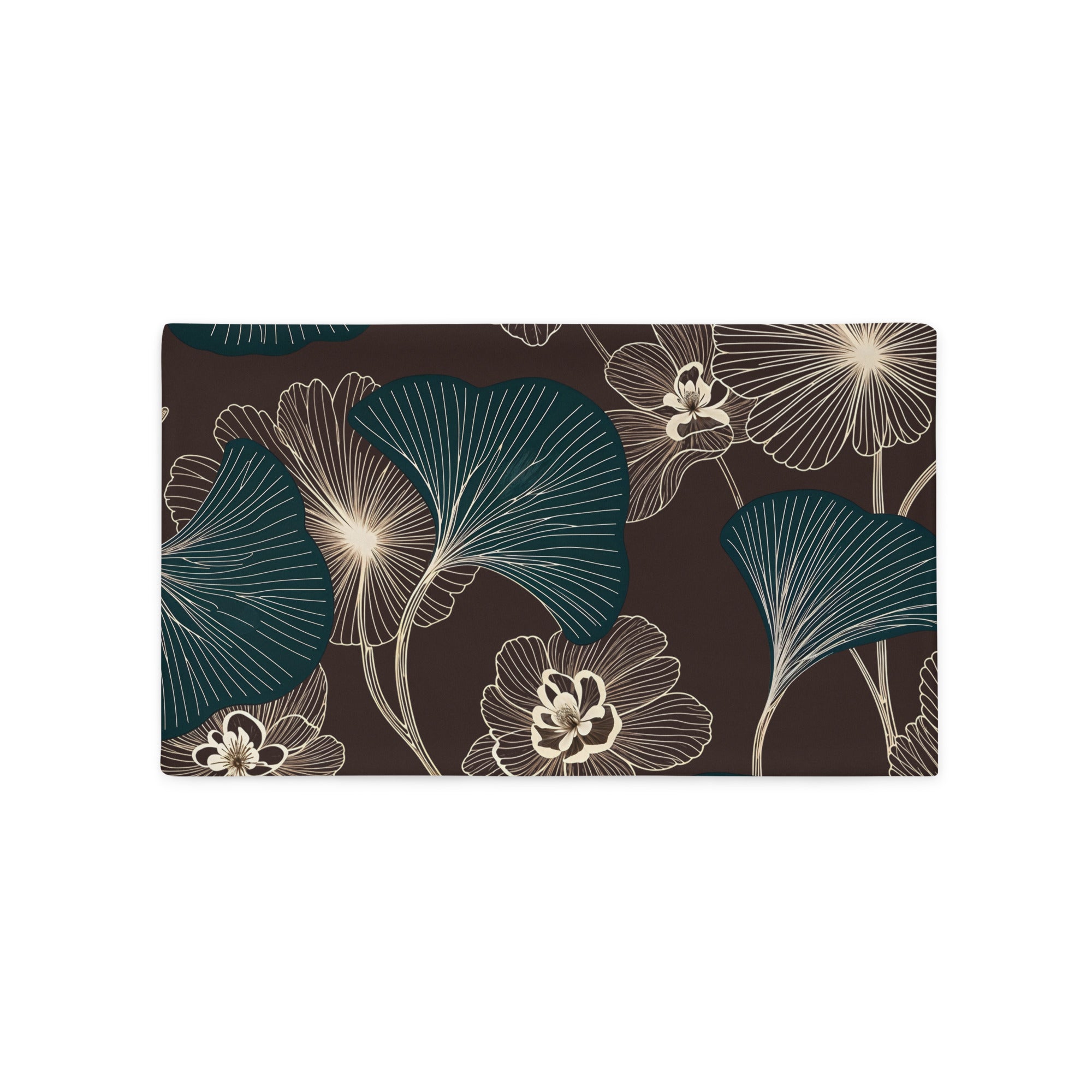 Coussin décoratif rectangulaire style moderne Mzelle design, aux motifs all over feuille de ginkgo délicatement stylisés, fleurs écru sur fond marron foncé.