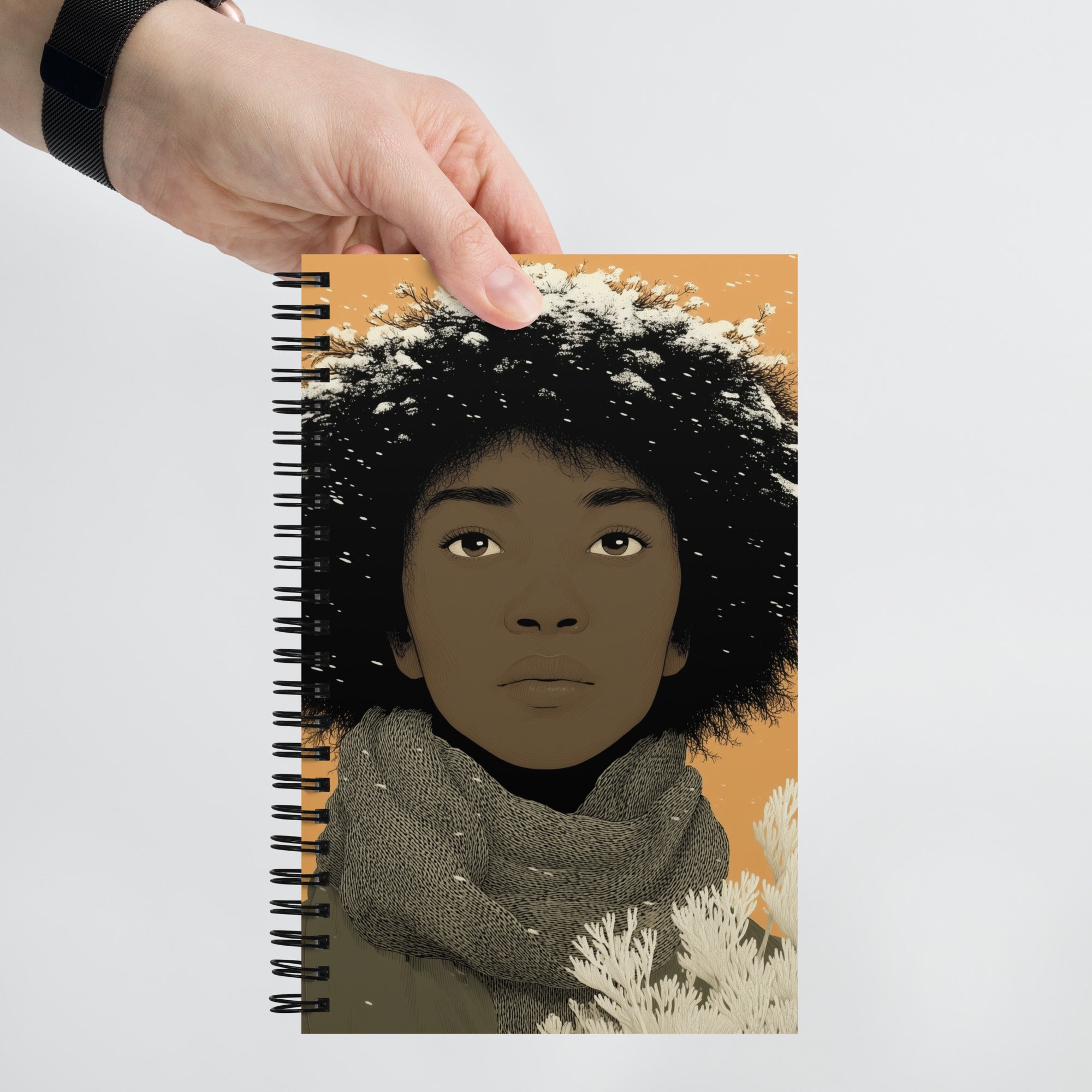 Carnet A5 Illustré par West Kast, style graphisme moderne, femme ethnique sous sous les flocons de neige, tons ocres et noirs