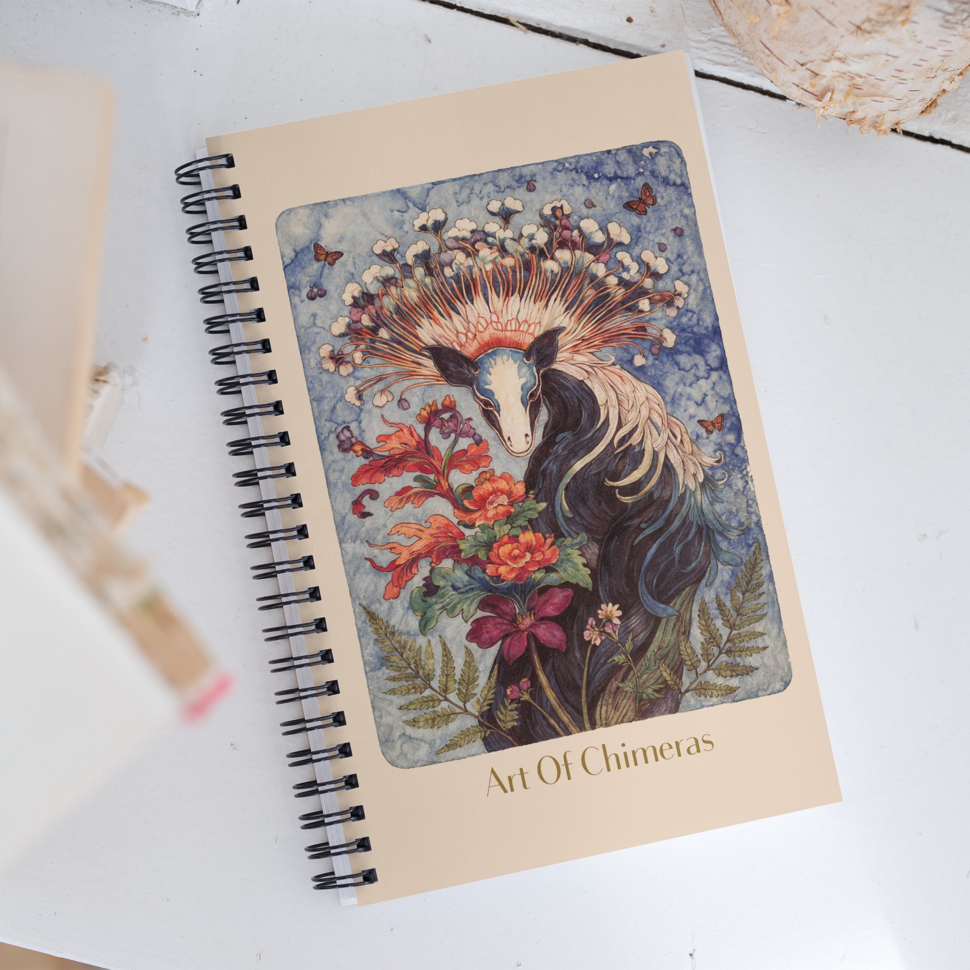 Carnet haut de gamme Mzelle Design, motif original chimère animal fabuleux style naturaliste, effet aquarelle, fleurs et papillons.